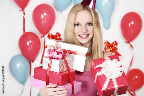 Photo: Sexy young blonde girl holding a gift Sexy young blonde girl holding a gift