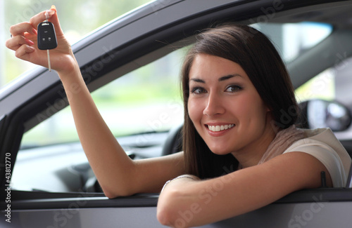 Photo: Happy smiling woman with car key. Driving Happy smiling woman with car key. Driving