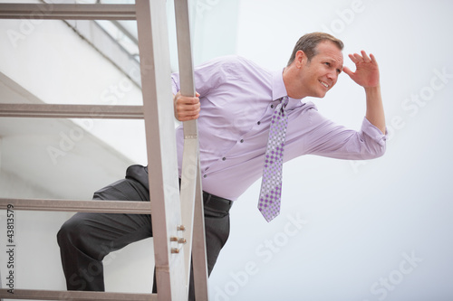 Photo: Businessman searching for opportunity Businessman searching for opportunity