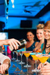 Foto: People in club or bar drinking cocktails People in club or bar drinking cocktails