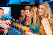 Foto: People in club or bar drinking cocktails People in club or bar drinking cocktails
