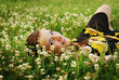 The beautiful girl lays in a grass