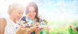 Portrait of two happy women mother and daughter looking their ph