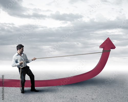 Photo: Businessman changes statistics Businessman changes statistics