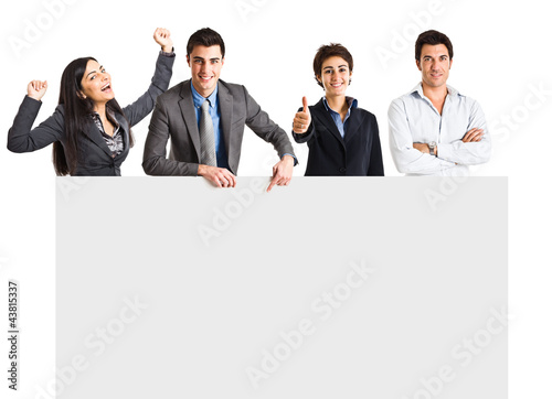 Photo: Group of people behind a blank board Group of people behind a blank board