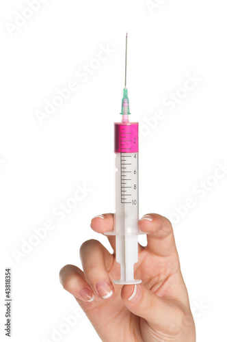 Photo: Hand with syringe Hand with syringe