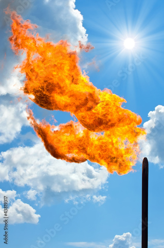 Photo: Gas flaring. Torch against the sky. Gas flaring. Torch against the sky.
