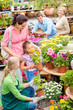 Photo: Family garden center shopping for flowers Family garden center shopping for flowers