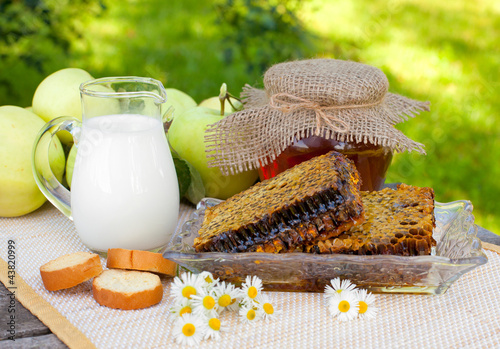 Photo: fresh honey combs, milk and fresh apples fresh honey combs, milk and fresh apples