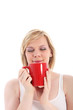 Photo: Woman savouring a mug of hot coffee Woman savouring a mug of hot coffee