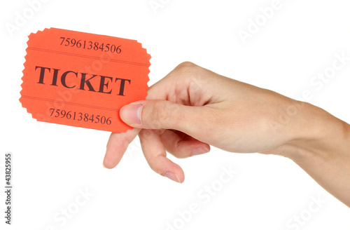 Photo: Woman's hand holding a colorful ticket Woman's hand holding a colorful ticket