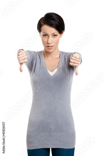 Foto: Young beautiful woman thumbs down, isolated on white Young beautiful woman thumbs down, isolated on white