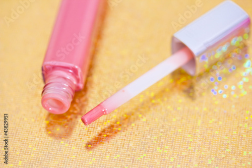 Photo: pink lipgloss with flower petals pink lipgloss with flower petals
