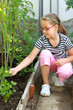 Cute girl in the hothouse
