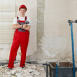 Young worker fixing up a house in his apprenticeship