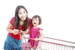 Mother with daughter on trolley