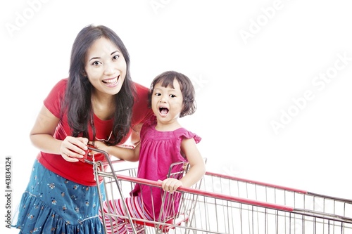 Photo: Mother with daughter on trolley Mother with daughter on trolley