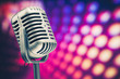 retro microphone on purple disco background