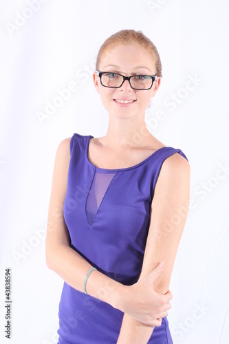 Foto: Beautiful redhead woman with eyeglasses Beautiful redhead woman with eyeglasses