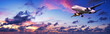 Jet aircraft is maneuvering for landing in a spectacular sunset