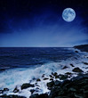 full moon and wil sea in the night