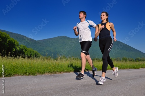 Photo: Young couple jogging Young couple jogging