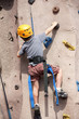 boy rock climbing indoor