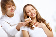 Young couple at home with present