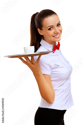 Foto: Young waitress with an empty tray Young waitress with an empty tray