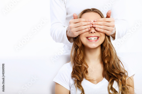 Photo: Young couple at home with present Young couple at home with present