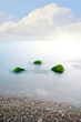 stones into the sea