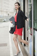 Woman exiting from a bus