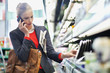 Woman in a supermarket talking on a mobile phone