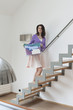 Woman carrying a box of clothes