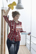 Woman cleaning glass door
