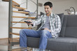 Man changing channels with a remote control