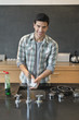 Portrait of a man washing dishes in the kitchen
