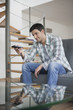 Man changing channels with a remote control