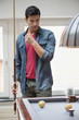 Man looking at a pool table