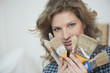 Portrait of a woman holding paintbrushes