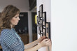 Interior designer measuring painting size