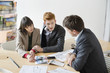 Real estate agent discussing property documents to his clients