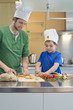Man and son cooking in the kitchen