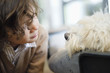 Close-up of a boy looking at a dog