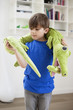 Boy playing with animals toys