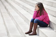 Girl sitting on the steps and smiling