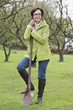 Woman standing with a shovel