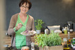 Portrait of a woman tasting food