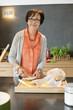 Woman applying butter on bread