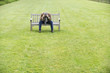 Depressed man sitting on a bench in a park